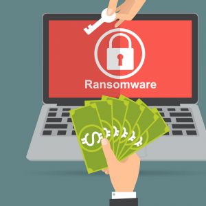 thumbnail for ransomware - a graphic of a key being swapped for money over a locked laptop